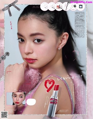 A magazine page with a picture of a woman in a pink dress.
