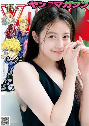 A woman in a red sweater is posing for a magazine.