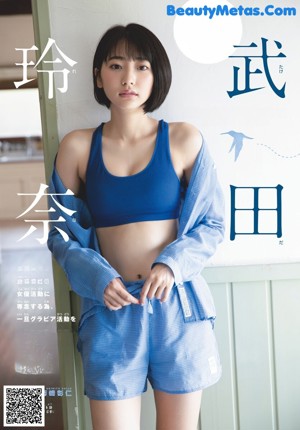A woman laying on a bed reading a book.