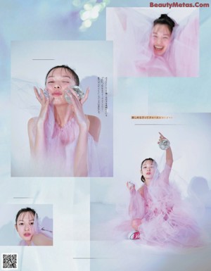 A woman is posing in front of a magazine advertisement.